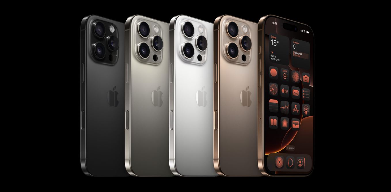 Apple iPhone 16 Pro Max displayed in all available colors Desert Titanium, White Titanium, Black Titanium, and Natural Titanium.